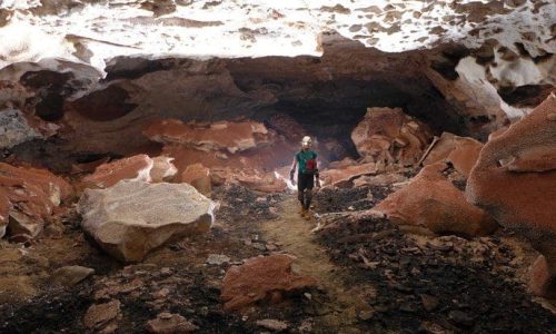 Spelunker walking through Jewel Cave National Monument in Custer, South Dakota